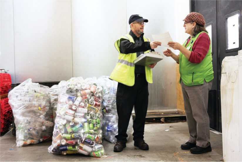 Staff Receiving Bags of Container